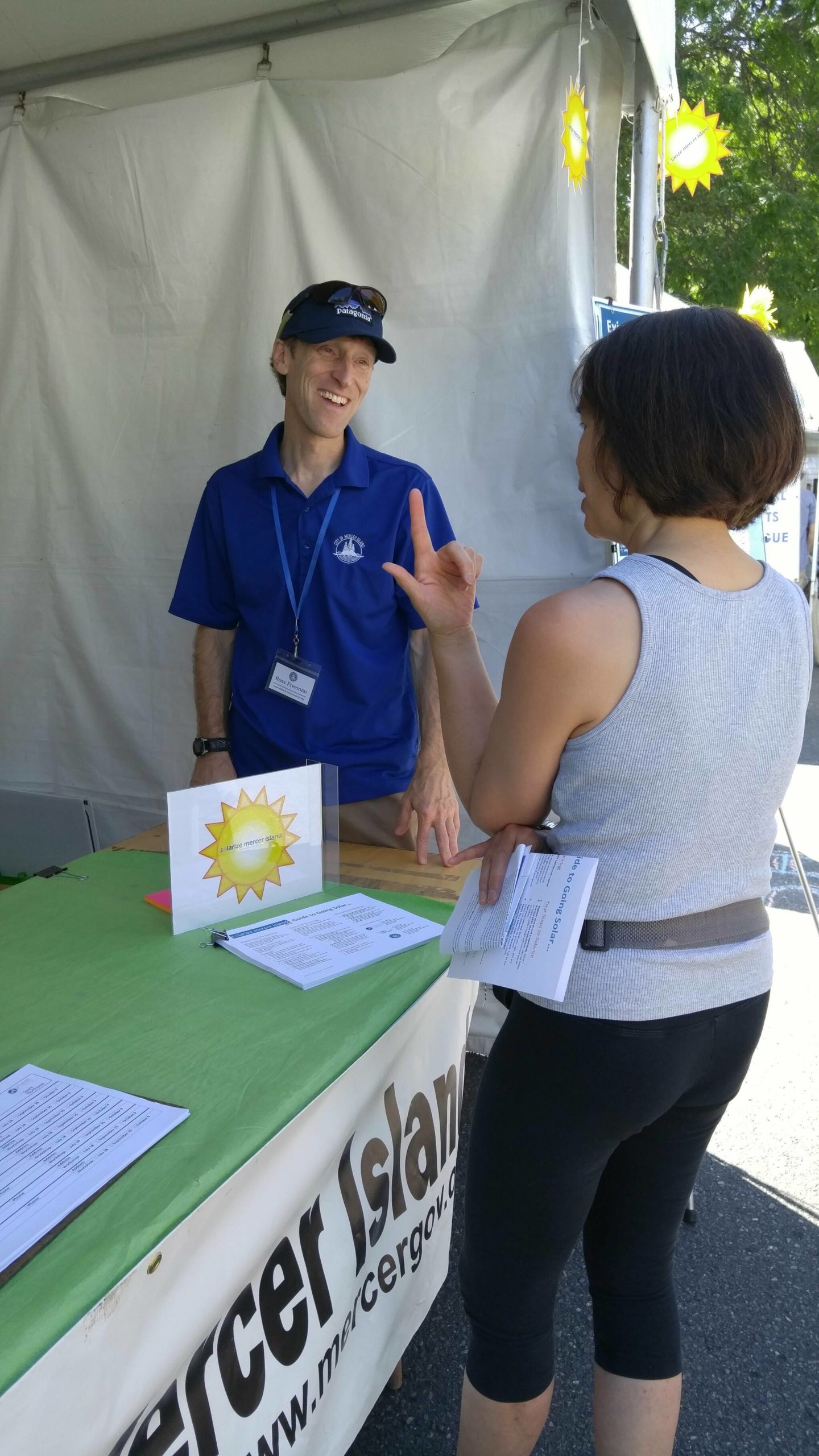 Courtesy photo
Ross Freeman, the city of Mercer Island’s sustainability program analyst, chats with an attendee at the 2018 Summer Celebration.