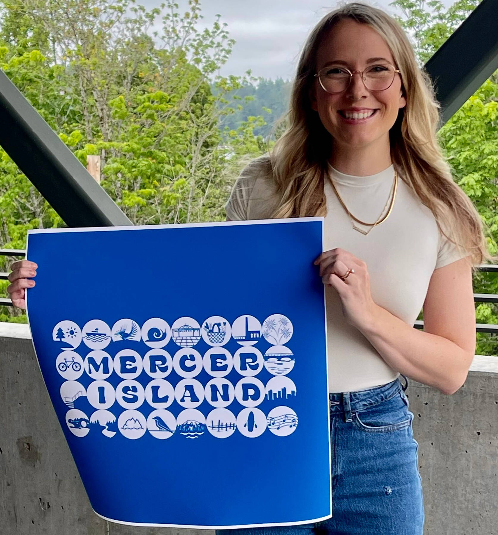 Ashley Dimick holds her winning city of Mercer Island design. Photo courtesy of the city of Mercer Island