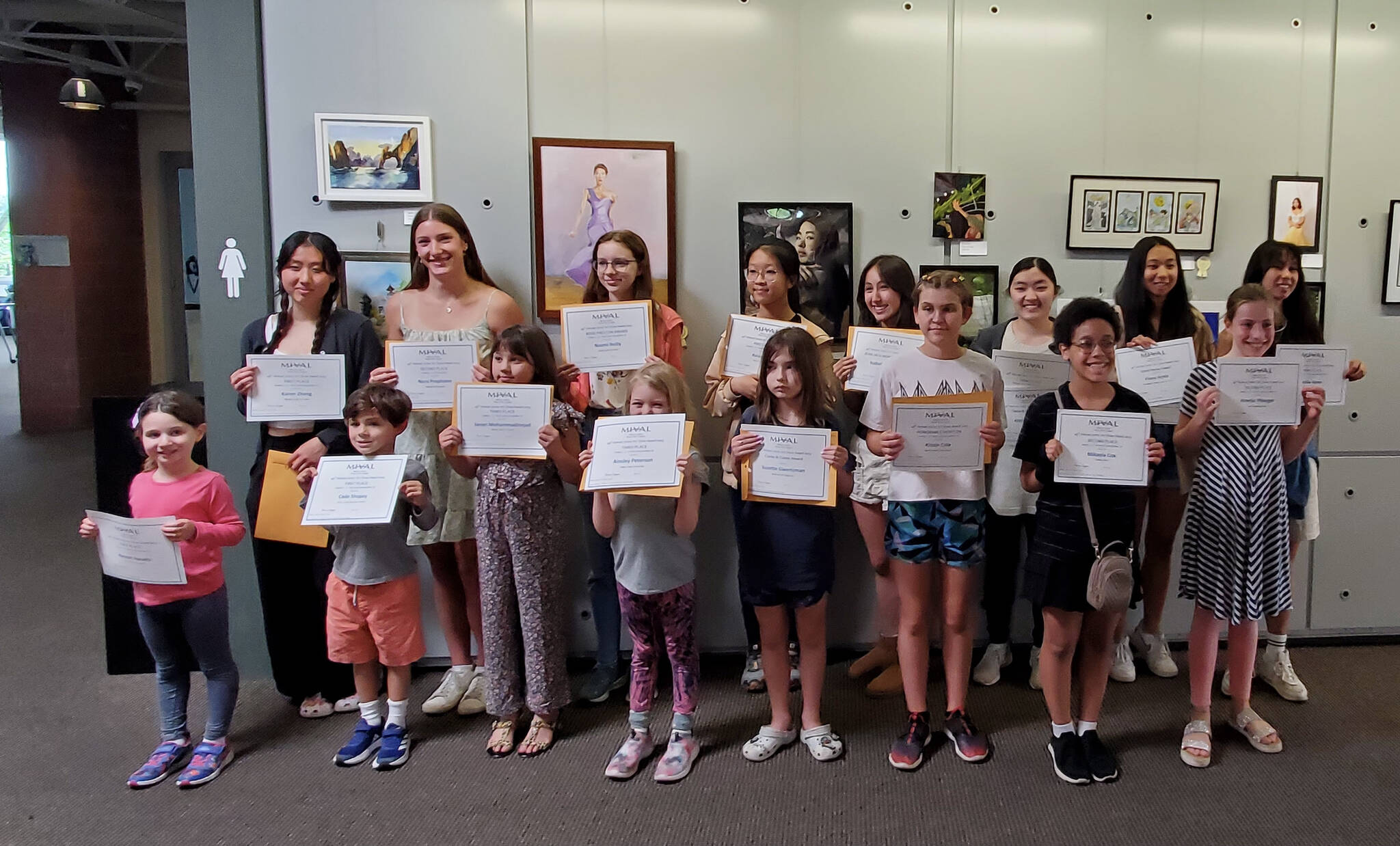 Winners in the MIVAL (Mercer Island Visual Arts League) 49th Annual Junior Art Show for children in grades K-12. Front row, left to right: Hannah Hurwitz, Cade Shopay, Janan Mohammadinejad, Ainsley Peterson, Suzette Gwertzman, Kinzie Cole, Mikayla Cox and Amelie Pfleeger. Back row, left to right: Karen Zhang, Nora Prophater, Naomi Reilly, Aviana Cai, Isabelle Anderson, Ashley Iwasaki, Fiona Ayres and Cecilia Ayres. Photo courtesy of Carol Whitaker