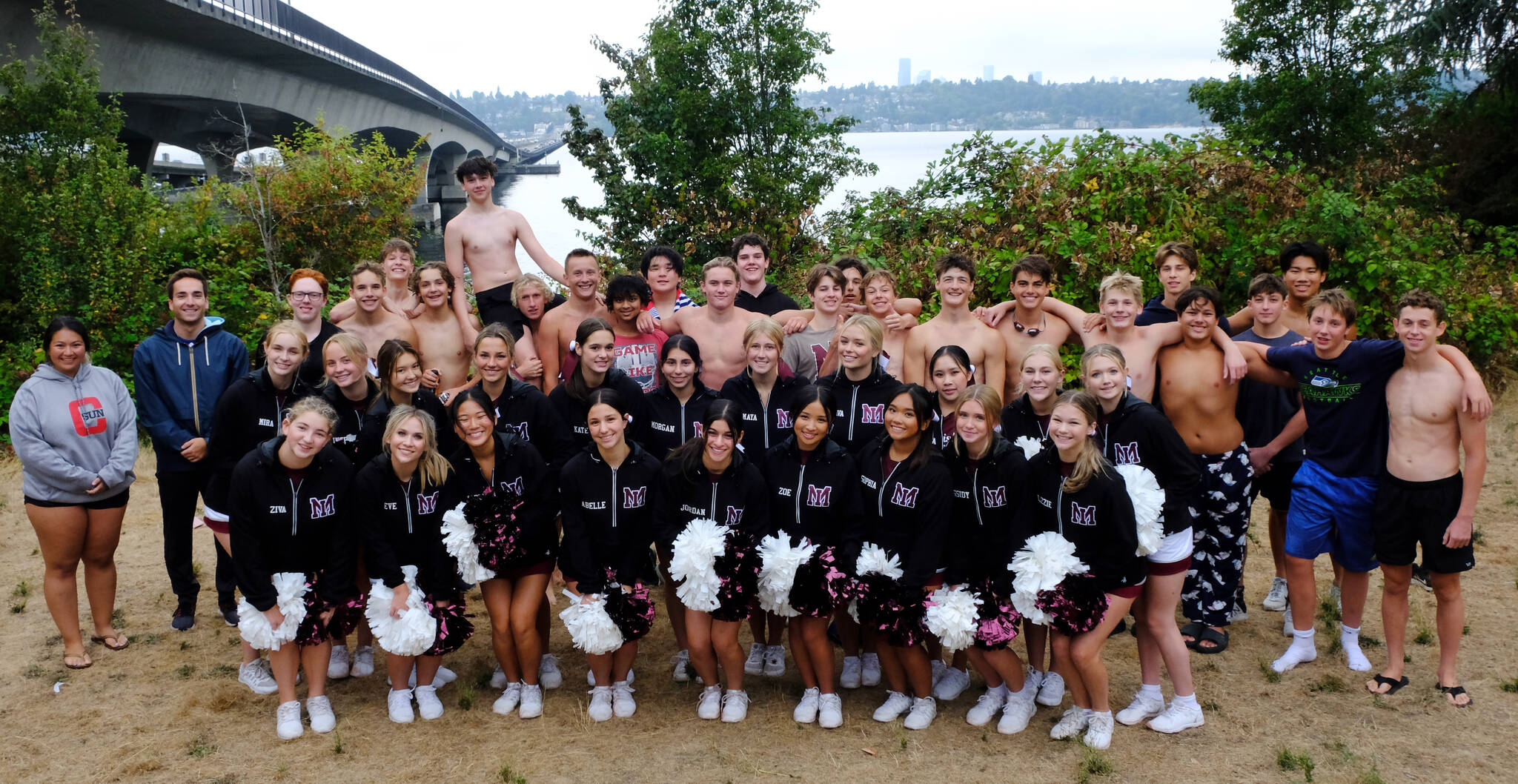 Mercer Island High School boys water polo team members gather with their coaches and the school’s cheerleaders on Aug. 29. Courtesy photo