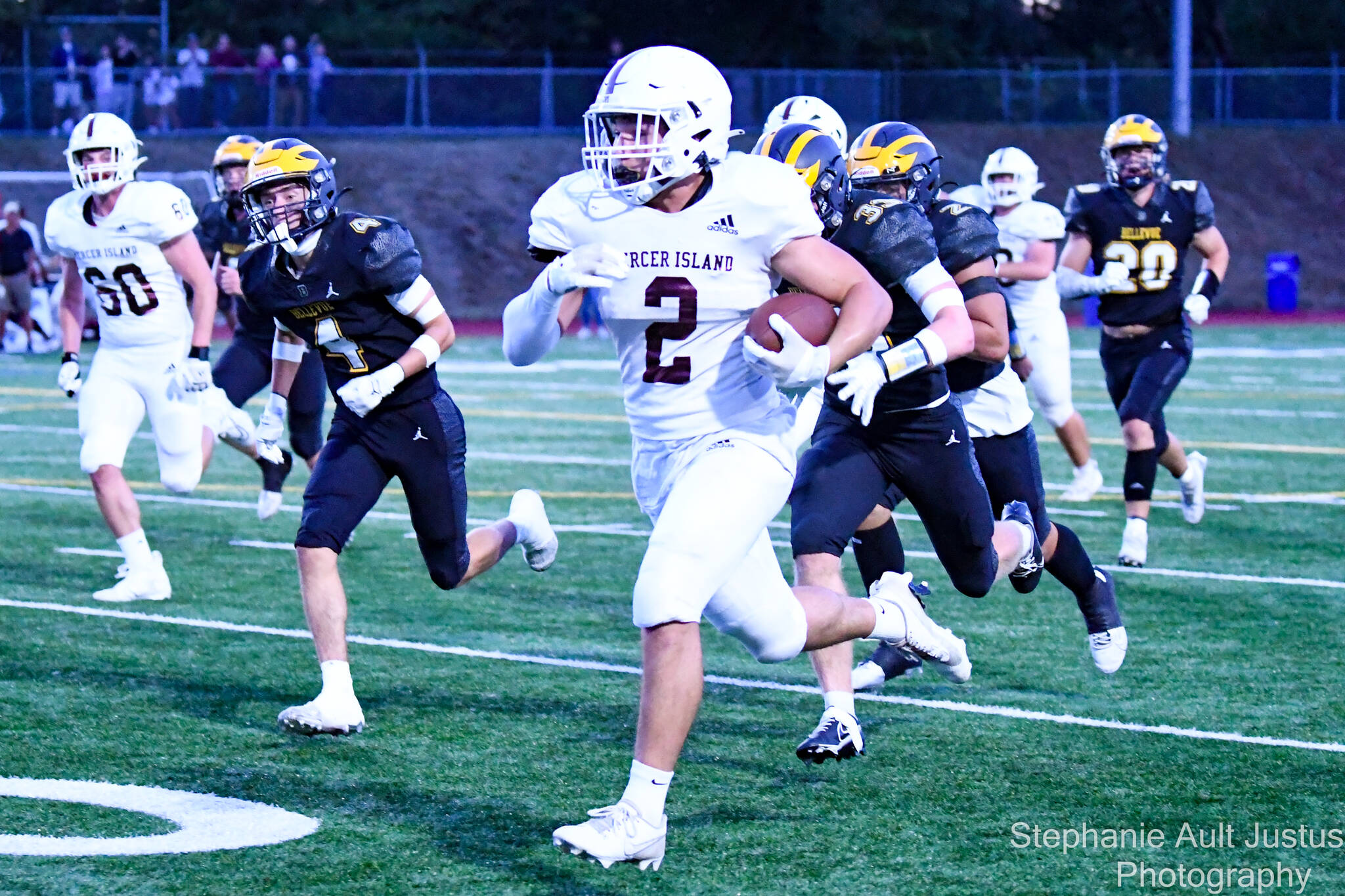 Mercer Island High School running back Cole Krawiec turns on the jets for a touchdown on the first Islander possession of the game on Sept. 22. Bellevue won the game, 56-21. On Sept. 29, MI beat Hazen, 31-7. Against Bellevue, Krawiec had 20 rushes for 125 yards and two touchdowns; quarterback Spencer Kornblum was 17-29 passing for 201 yards and one touchdown; wide receiver Ryan Boyle snagged eight catches for 92 yards; and wide receiver Elan Gotel grabbed three catches for 72 yards and one touchdown. Photo courtesy of Stephanie Ault Justus