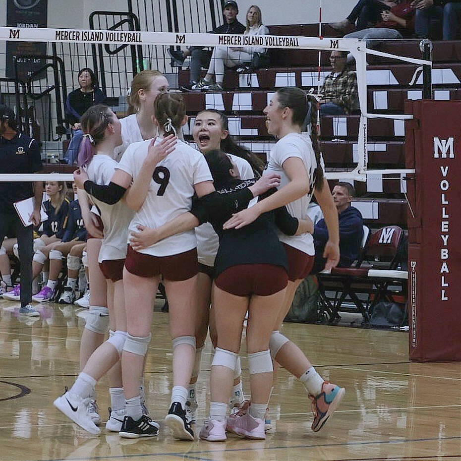 Mercer Island High School volleyball players get fired up during their 3-1 victory over Bellevue High School on Oct. 4. Junior right side player Nora Prophater amassed 11 aces, 10 kills and four blocks; senior middle blocker Logan Remington tallied eight kills and four blocks; senior libero Aditi Mannby had 14 digs and passed a 2.01 on serve receive; and senior setter Melena Wong nailed five aces and had 33 assists and nine digs. Overall, the team had 21 aces, 41 kills and 44 digs. Photo courtesy of Amy Hopkins