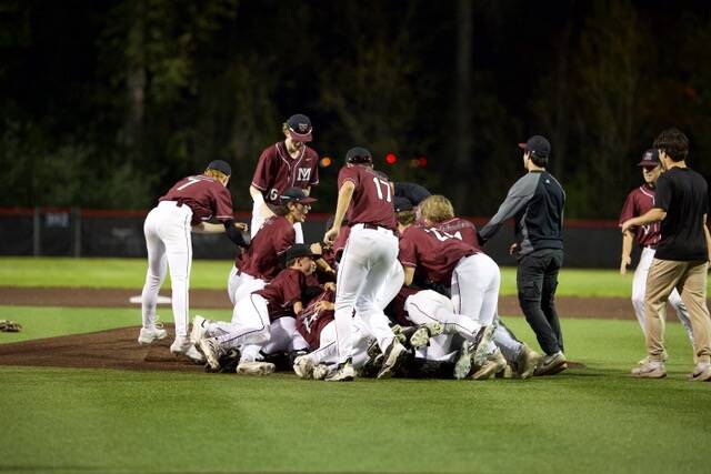 Mercer Island High School baseball players celebrate their victory over Juanita on May 9 to advance to state. Photo courtesy of Bernard Mangold