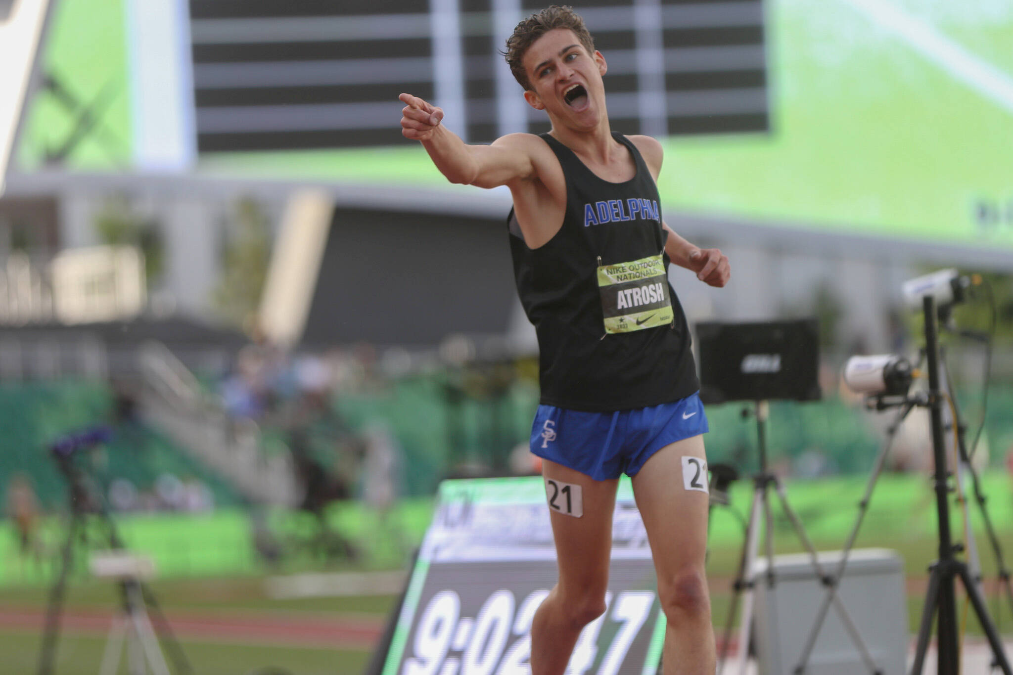 Mercer Islander Hudson Atrosh excitedly crosses the finish line in first place in the Emerging Elite two-mile race on June 14 at the Nike Outdoor Nationals at Hayward Field in Eugene, Oregon. Photo courtesy of westcoastxc