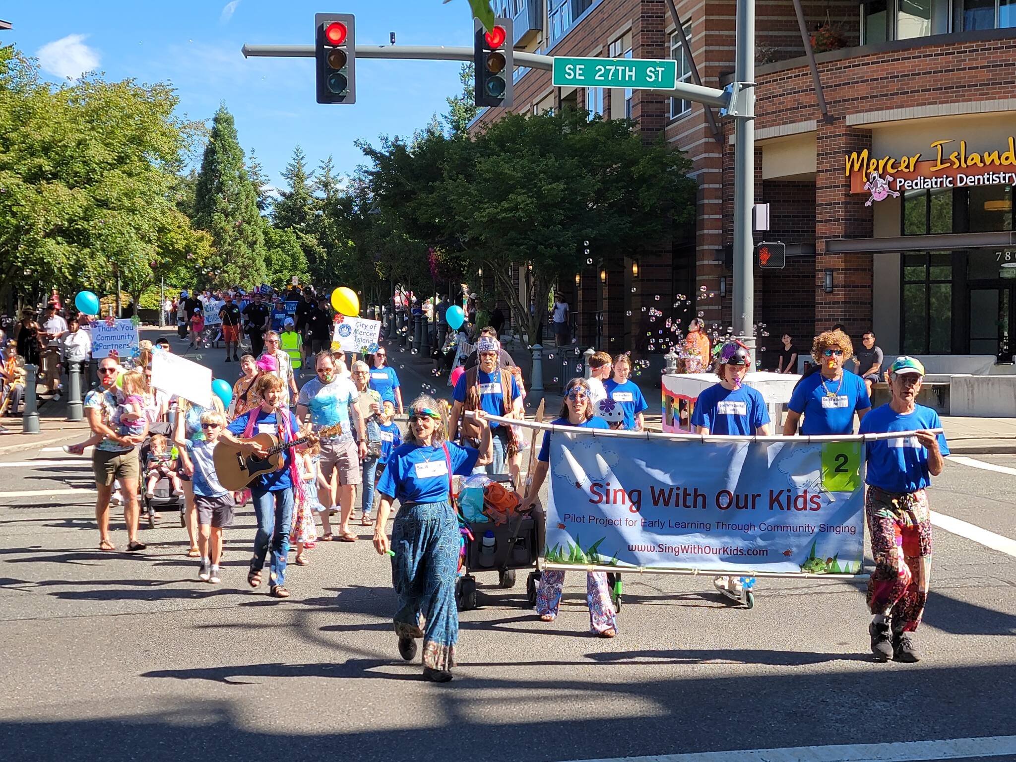 Nancy Stewart’s Sing With Our Kids and a bevy of other participants roll through the Summer Celebration community parade last year. Photo courtesy of the city of Mercer Island