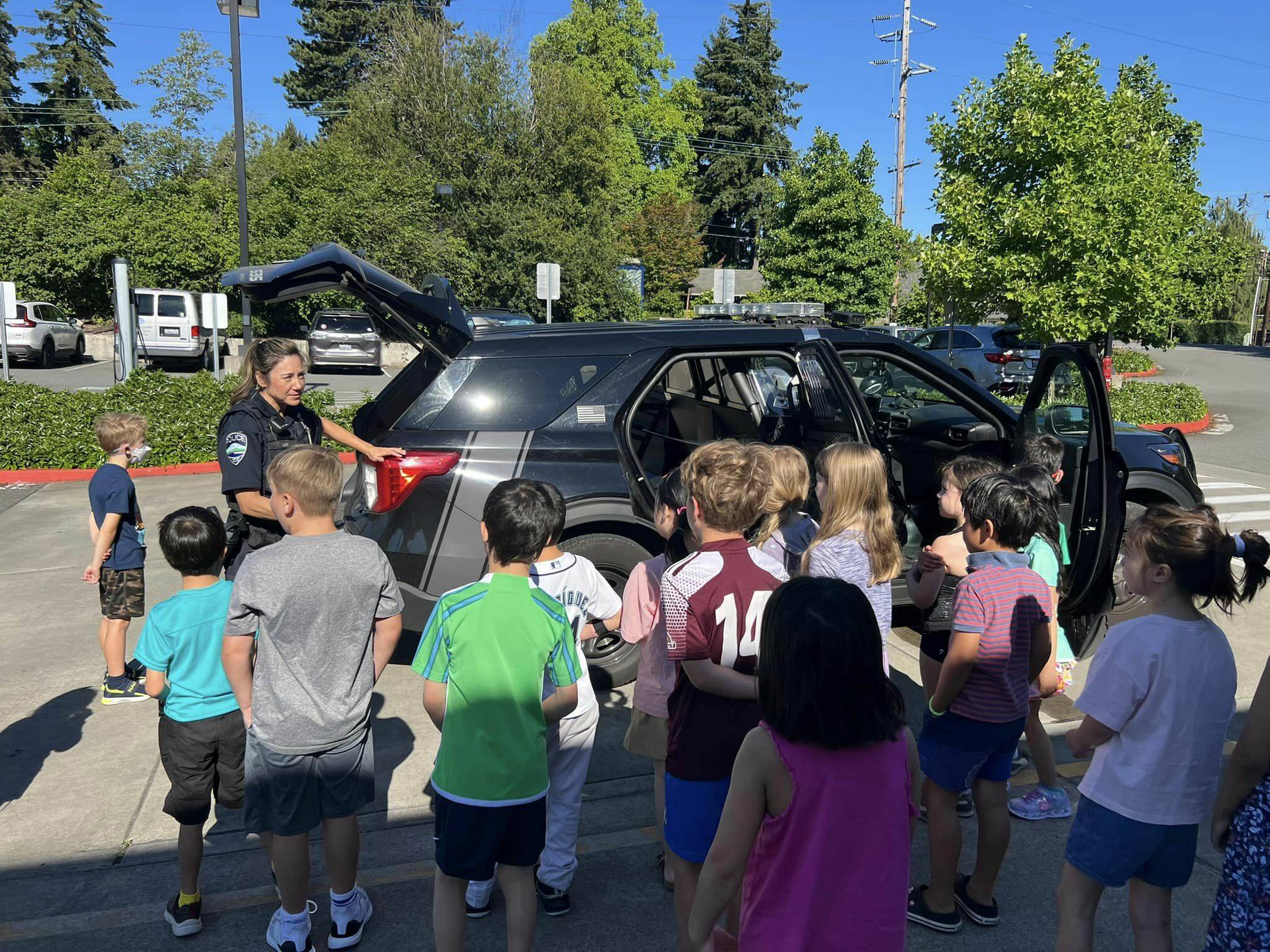 Mercer Island Police Department officer Kristina Lum visited with summer school students at Northwood Elementary on July 8 and displayed her police cruiser. Photo courtesy of Mercer Island School District