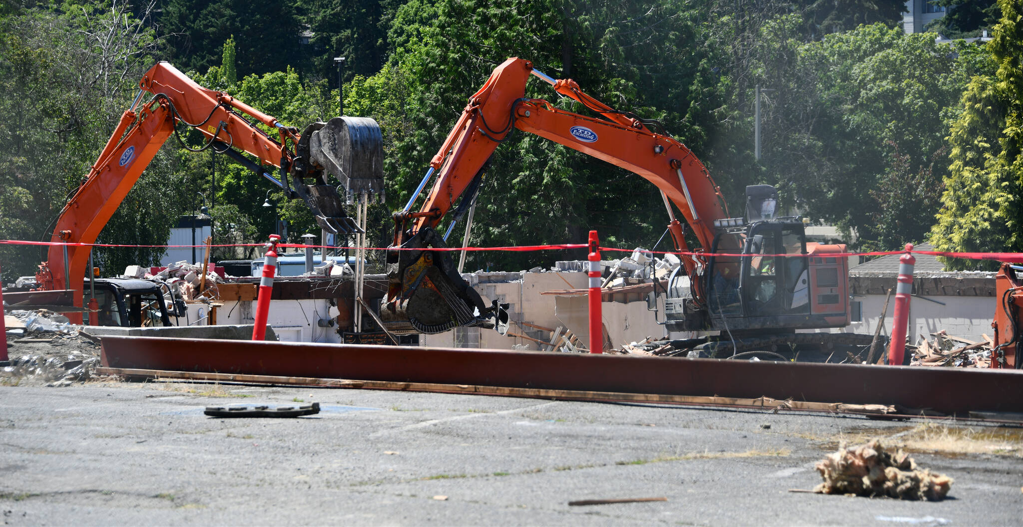 Construction workers plow away on July 8 at the future site of the Xing Hua mixed-use development project. Andy Nystrom/ staff photo