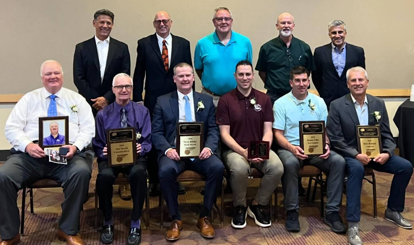 Mercer Island High School boys basketball coach Gavin Cree (front row, third from right) was selected as the Washington State John Wooden Award winner by the Washington Interscholastic Basketball Coaches Association (WIBCA) at its Hall of Fame Banquet on July 17 at the Cowlitz County Event Center in Longview. “It is a great honor and very humbling to receive this award from WIBCA,” said Cree. “To me, this is a community award. The student-athletes, assistant coaches, families, administrators have all played a major role in building a program that is a true brotherhood across generations.” The recognition seeks to honor scholastic basketball coaches around the country who are educators and have achieved excellences on the floor, in the classroom and in the community that further embody the characteristics and legacy of former University of California, Los Angeles basketball coach John Wooden. The criteria for this award are rooted in the ideals of education, longevity, character, service and excellence. Photo courtesy of the Mercer Island School District