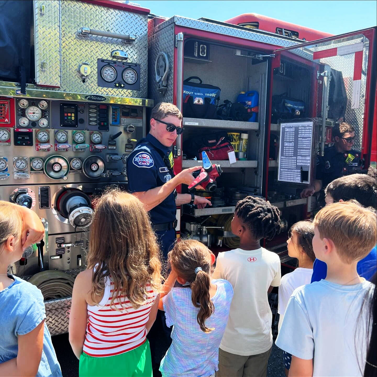 Mercer Island firefighters from Eastside Fire & Rescue dropped by Northwood Elementary School on Fire Department Day on July 18. The firefighters visited with summer school students, showed off their truck and explained how they help the community during emergencies. Photo courtesy of the Mercer Island School District