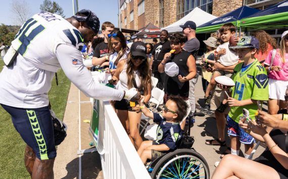 DK Metcalf shares a fist bump with a young fan. Photo provided by Maria Dorsten.