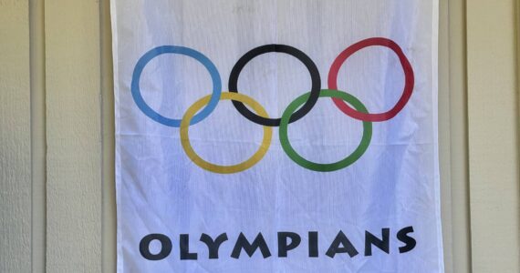 This banner outside Greg Asimakoupoulos’ home illustrates that a competitor in the Olympics of Life lives inside. Courtesy photo