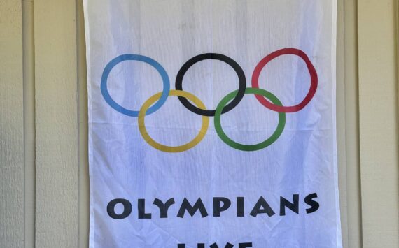 This banner outside Greg Asimakoupoulos’ home illustrates that a competitor in the Olympics of Life lives inside. Courtesy photo