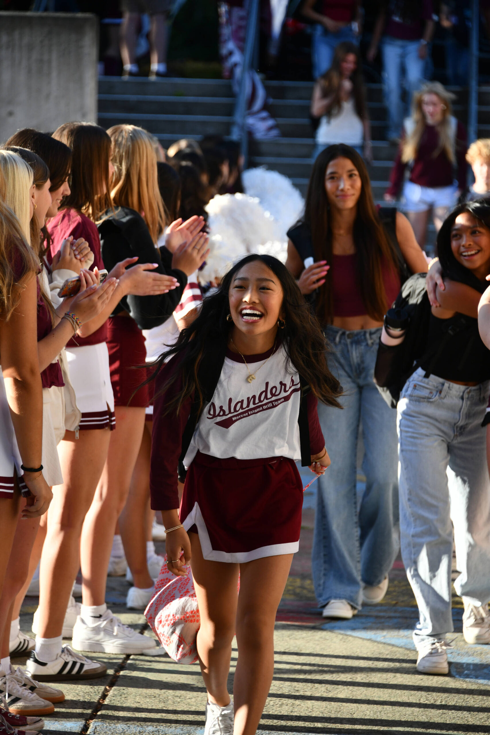 It was all smiles as members of the Mercer Island High School drill team and drum corps along with other students welcomed ninth-graders onto campus on the first day of school on the morning of Aug. 28. Andy Nystrom/ staff photo