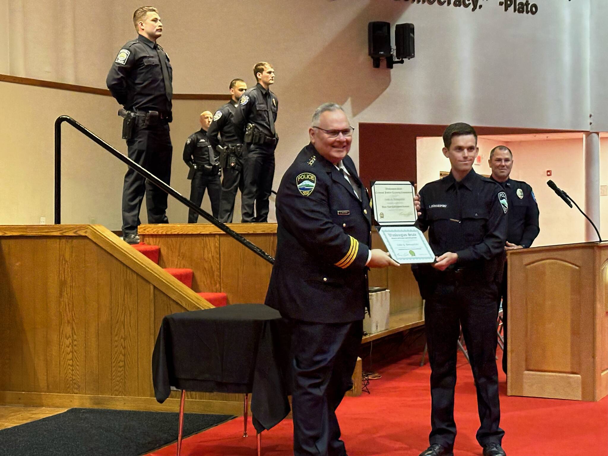 Luke Bonagofski, second from right, was sworn in by Mercer Island Police Department Chief Chris Sutter as the newest member of the department. The swearing-in ceremony took place immediately following graduation exercises at the Criminal Justice Training Center in Burien on Aug. 29. Officer Bonagofski received the highest award for academic achievement in the five-month program that included 29 candidates. Photo courtesy of Greg Asimakoupoulos