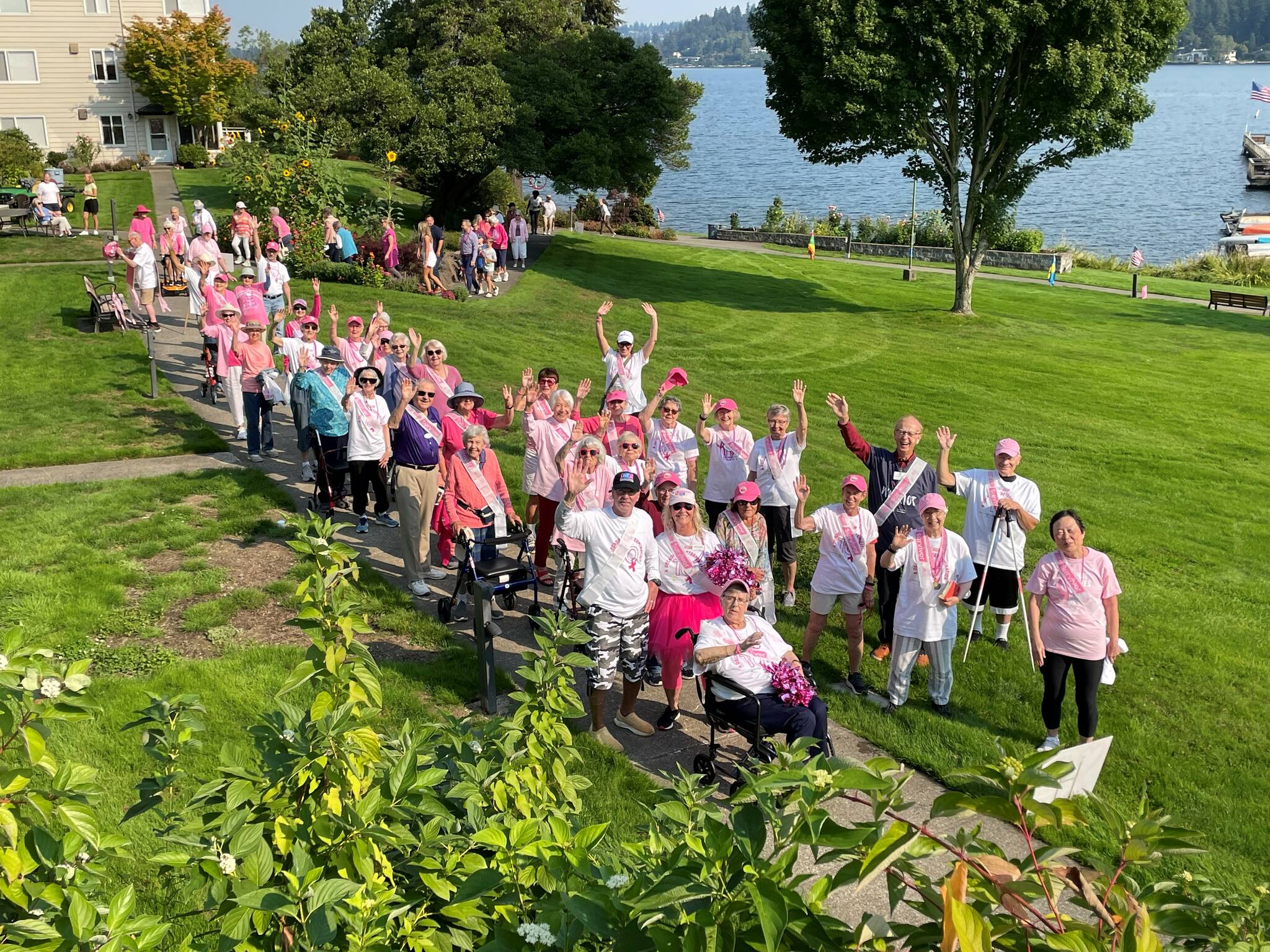 Participants — which included about 55 cancer survivors — traverse the path at the “Decade of Determination” Making Strides Against Breast Cancer Walk on Sept. 6 at Covenant Living at the Shores on Mercer Island. Photo courtesy of Roxanne Stickney