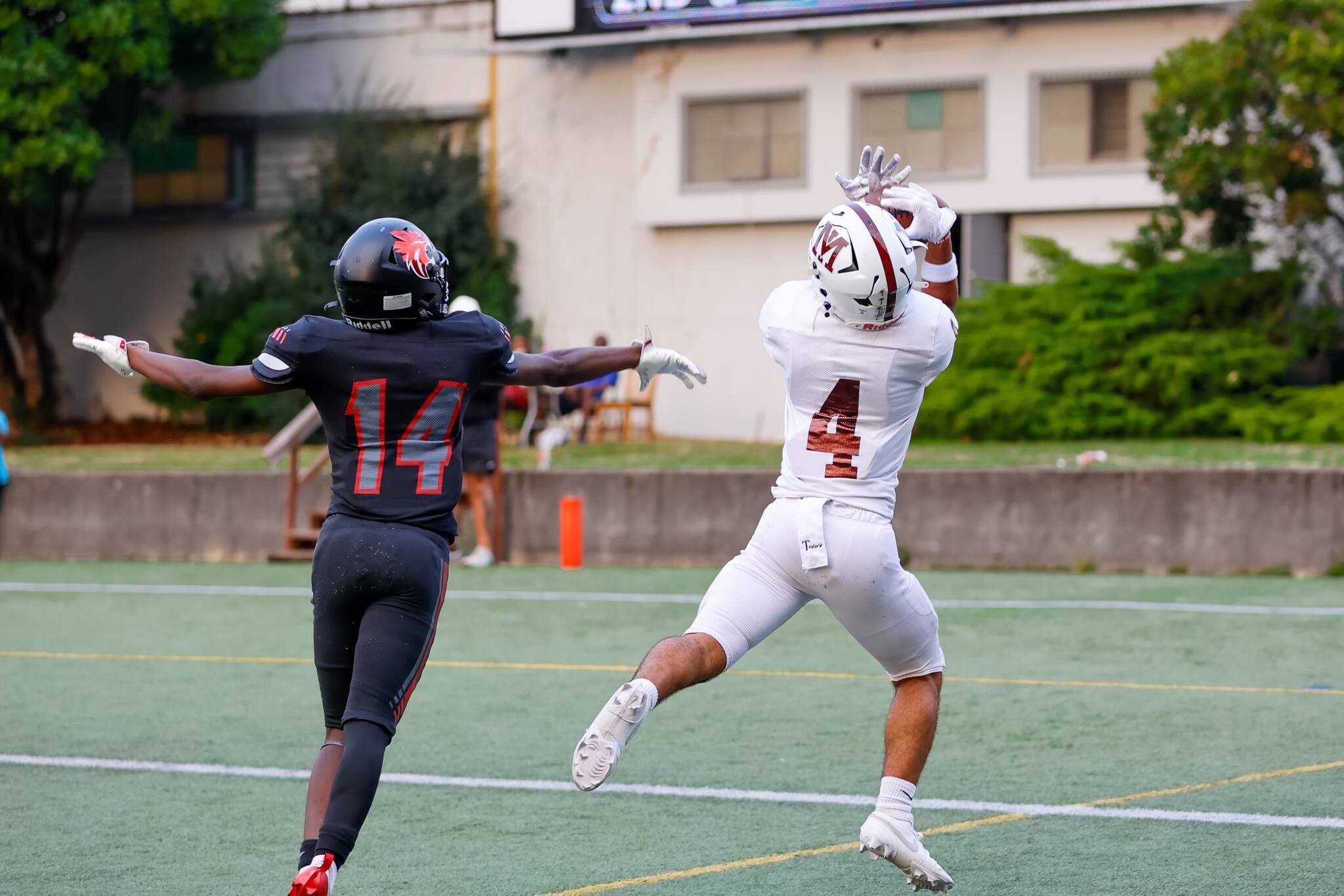 Mercer Island High School senior Elan Gotel snags a touchdown pass from junior quarterback Youngmin Lee against Lincoln on Sept. 7. Photo courtesy of Linda Kercher