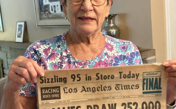 Greg’s neighbor Linda Nicholl holding front page of Sept 9, 1963 LA Times featuring her father’s cover story Photo courtesy of Greg Asimakoupoulos