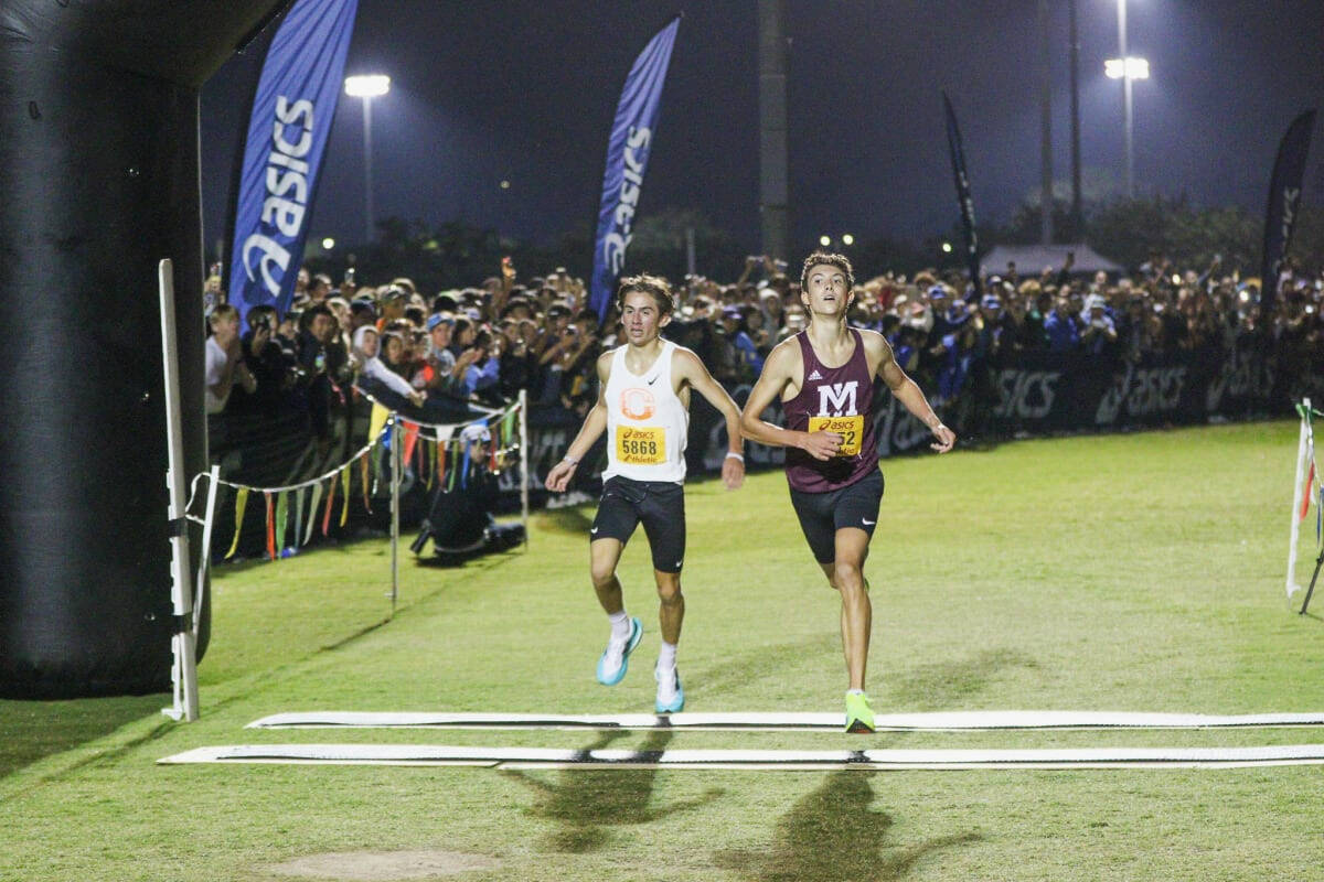 Mercer Island High School’s Owen Powell, right, inches out Josiah Tostenson of Oregon on Sept. 21 at the Woodbridge Cross Country Classic in Irvine, California. Photo courtesy of Ken Martinez, westcoastxc