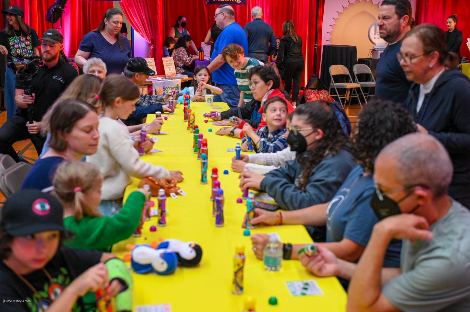 Attendees enjoy a lively game of Ladingo, similar to bingo, where participants can win prizes by having enough consecutive numbers called on their board. Photo courtesy of John Shaffer