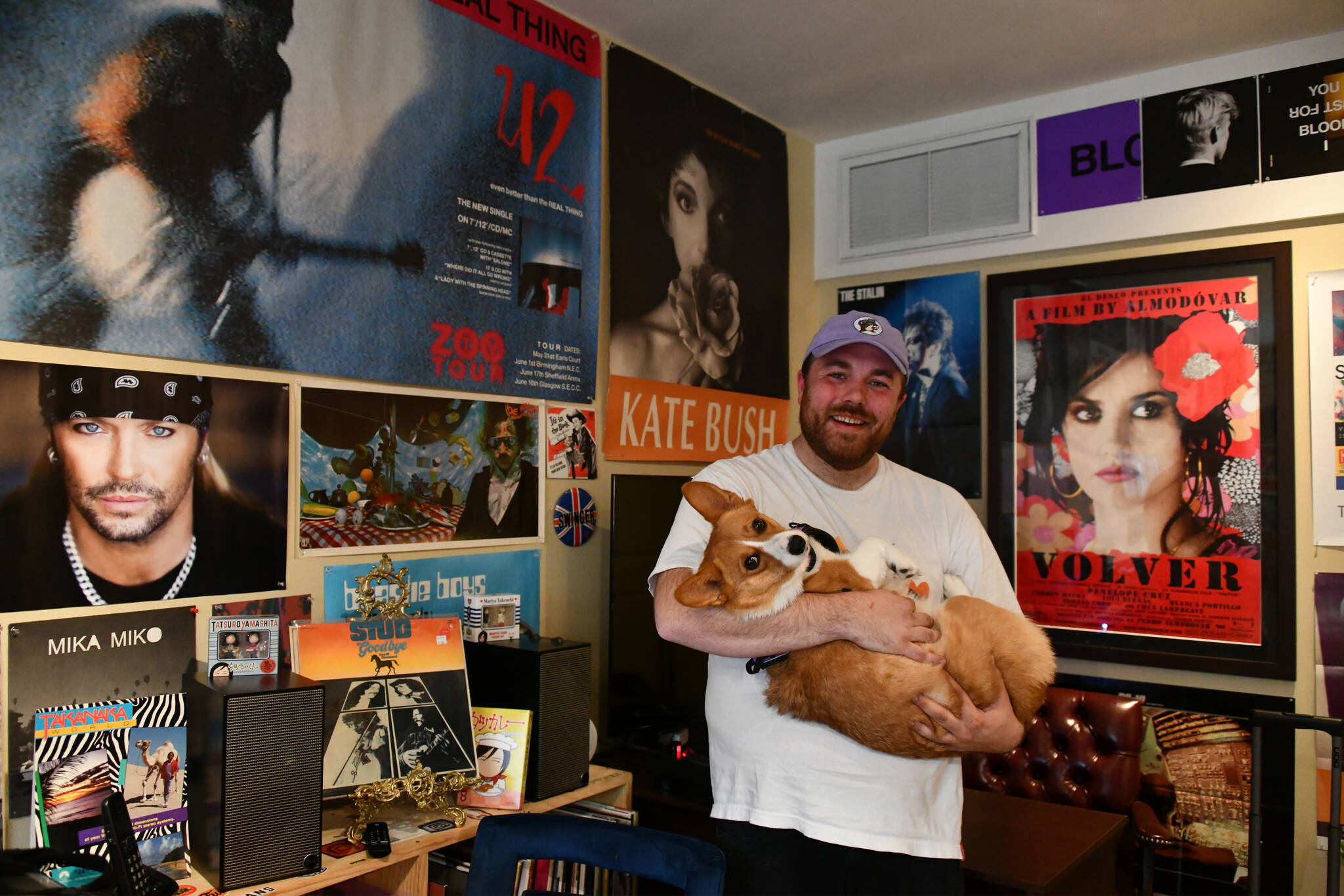 Volver Records owner John Packer cradles his corgi Sophie on a recent day at the store. Andy Nystrom/ staff photo