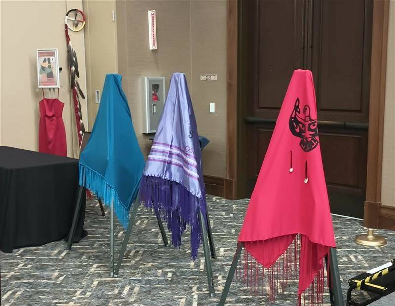 The Lummi Nation provided three colorful shawls during the MMIWP Task Force Summit in September, with turquoise representing human trafficking, purple representing overdoses (“losing our people from fentanyl”) and red representing murdered and missing Indigenous women — all crises that affect North American Natives and Tribes. The summit started with an opening ceremony with words from Lummi Tribal Chair Anthony Hillaire, Lummi Indian Business Council Secretary Lisa Wilson and a Shawl Ceremony with Lhaq’temish singers. Photo by Bailey Jo Josie/Sound Publishing