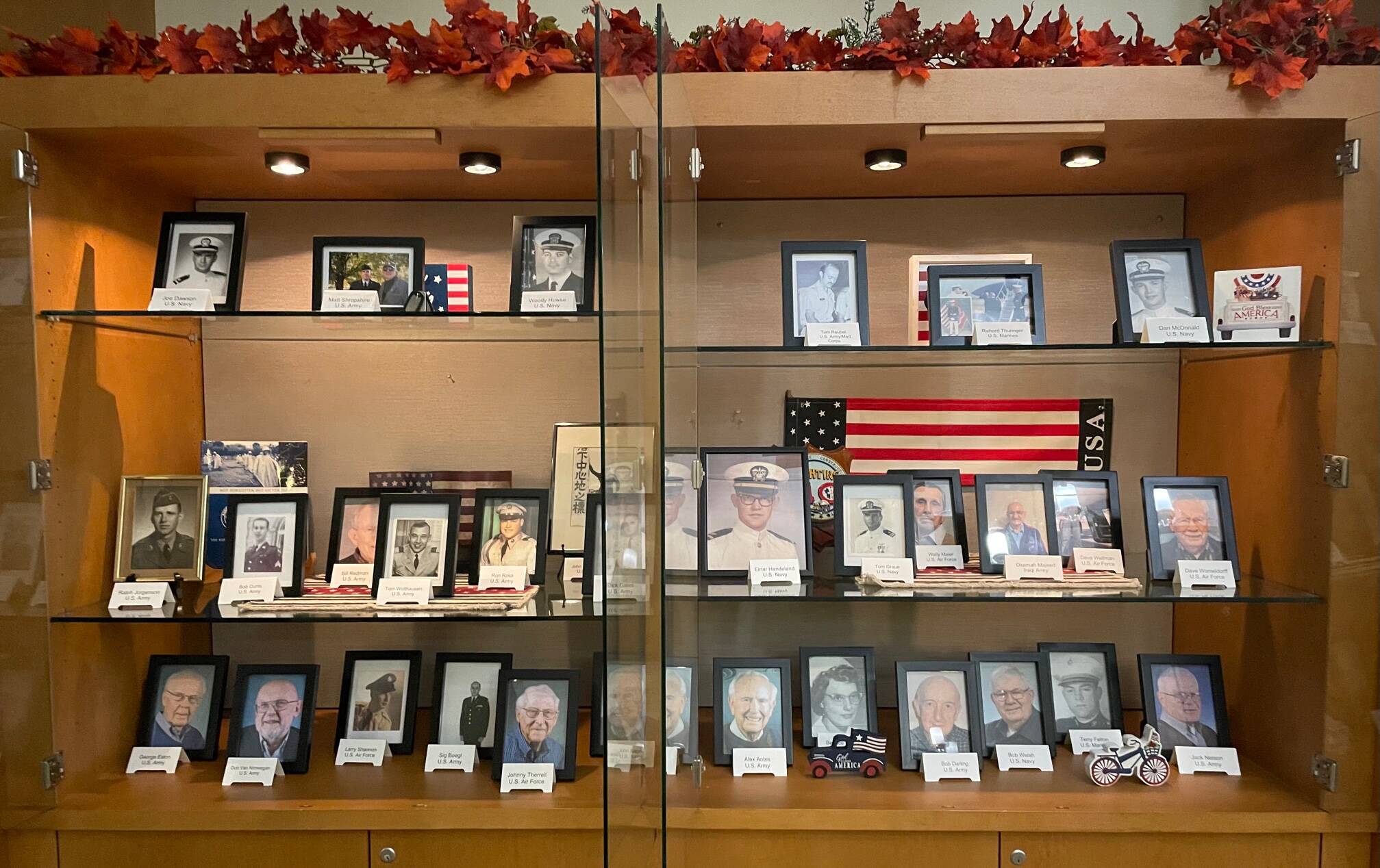 Mercer Island’s Covenant Living at the Shores resident and employee veterans who served in the military are being recognized at the senior living community for Veterans Day. The community has created a display in their lodge with more than 30 photos of those residents and employees who have served in various branches of the military. The community has also placed American flags along the walkways to also honor veterans. The veterans at Covenant Living were honored during a ceremony on Nov. 11 for residents and families. Courtesy photo