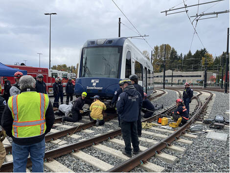 Eastside Fire & Rescue (EF&R) firefighters, including staff from Mercer Island stations 91 and 92, participated in several advanced trainings over the past few months. Local staff and other partner agencies have continued training in preparation for light rail activity across the Island. Crews utilized special equipment to practice lifting a train if needed in an emergency (pictured). EF&R units also trained with Olympic Pipeline to ensure crews are prepared to identify and handle pipeline-specific emergencies. At each station within the EF&R network, crews were tasked with a simulated rescue of a worker from a vault that contained a possible gas leak. Three EF&R firefighters also completed initial swift water rescue technician training on the Snoqualmie River and they can now operate in moving water to conduct rescues safely. Additionally, members of the EF&R Technical Rescue team are now certified elevator rescue technician instructors. Photo courtesy of the city of Mercer Island