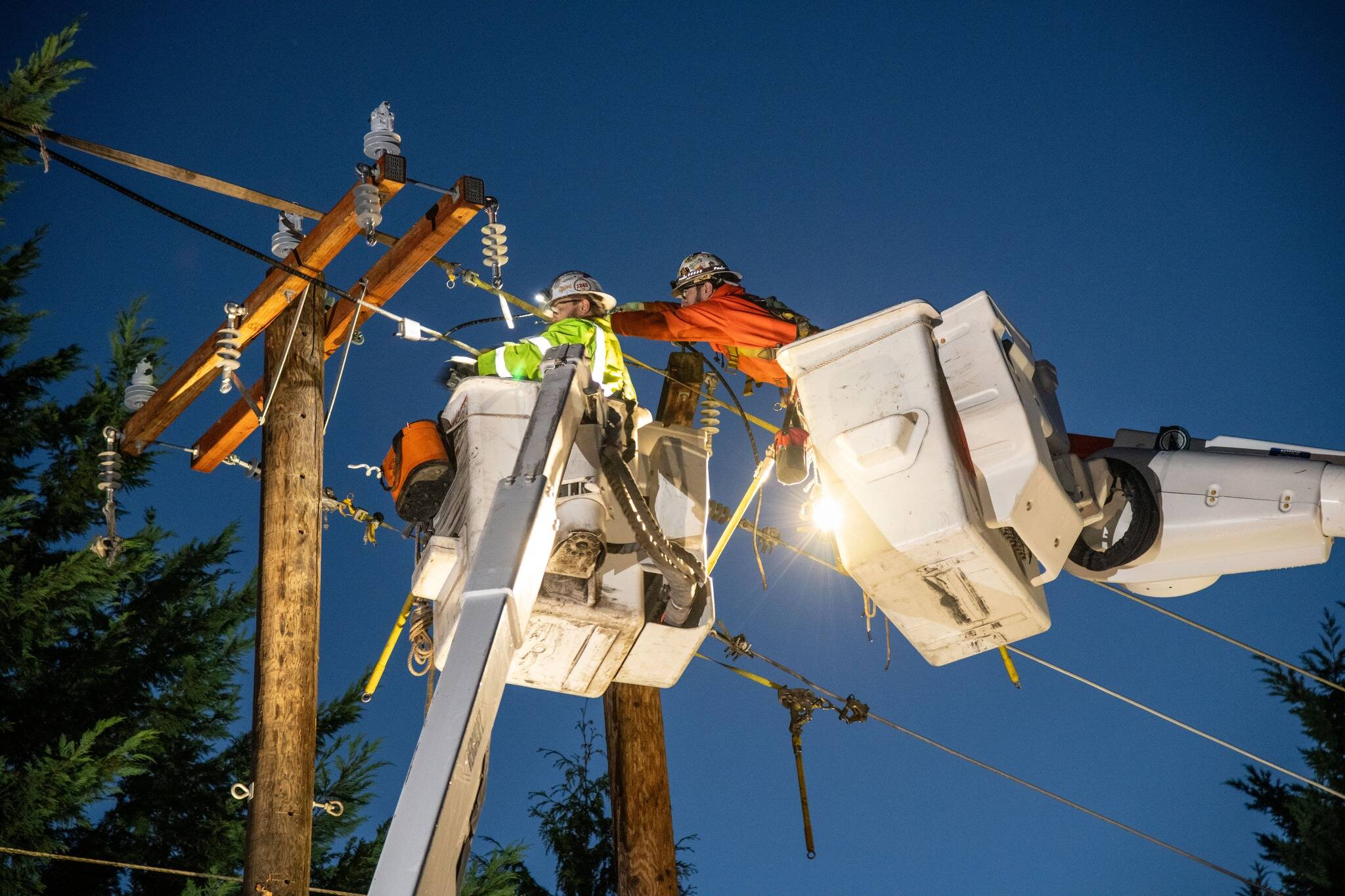 Puget Sound Energy employees work to restore power. Photo courtesy of Puget Sound Energy