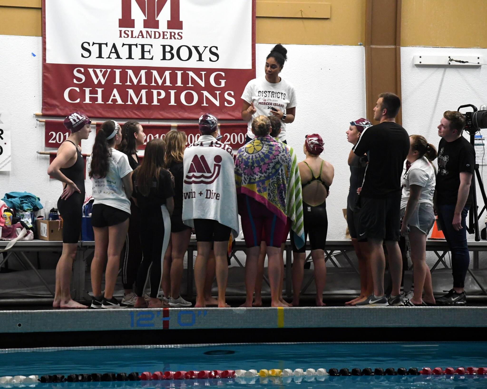 Chauntelle Johnson (top) coaches her Mercer Island High School girls swim and dive team. Courtesy photo