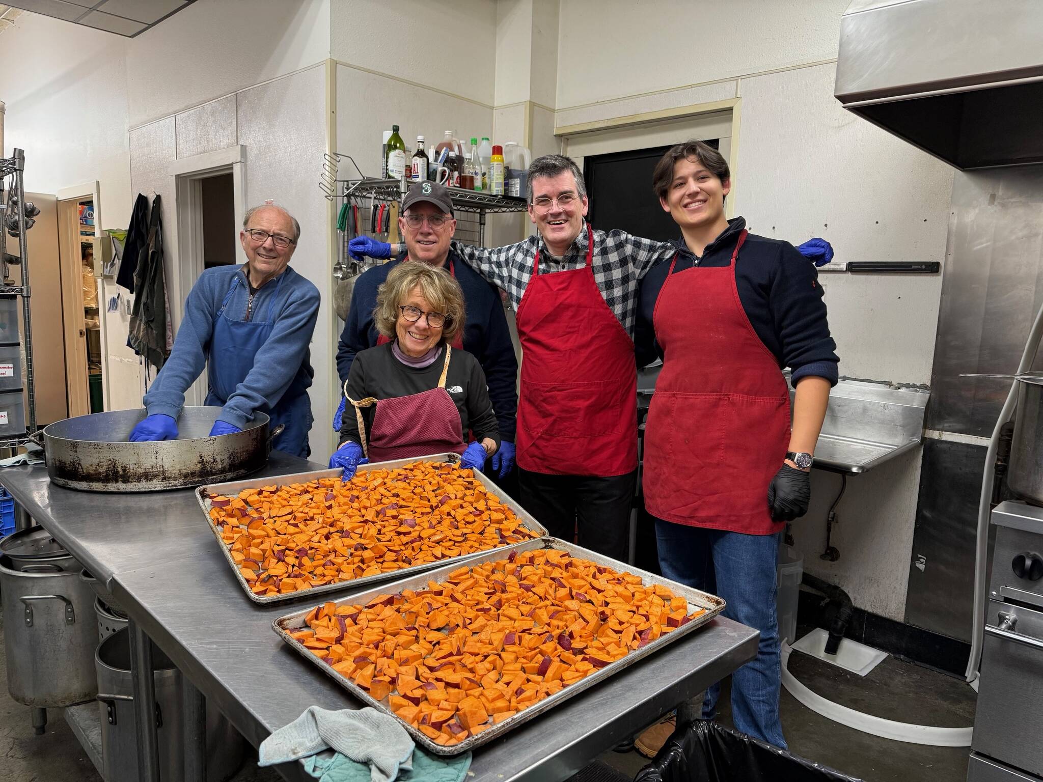 The Rotary Club of Mercer Island held a monthly service project on Nov. 27 at Operation Nightwatch in Seattle. This month, the five-member team prepared a Thanksgiving dinner for 150 homeless adults in Seattle. The dinner included turkey, sweet potatoes and green beans. Pictured are Terry Lee, Nancy Lee, Wally Boos, Ted Weinberg and Mir Mattia Ottaviani. Courtesy photo