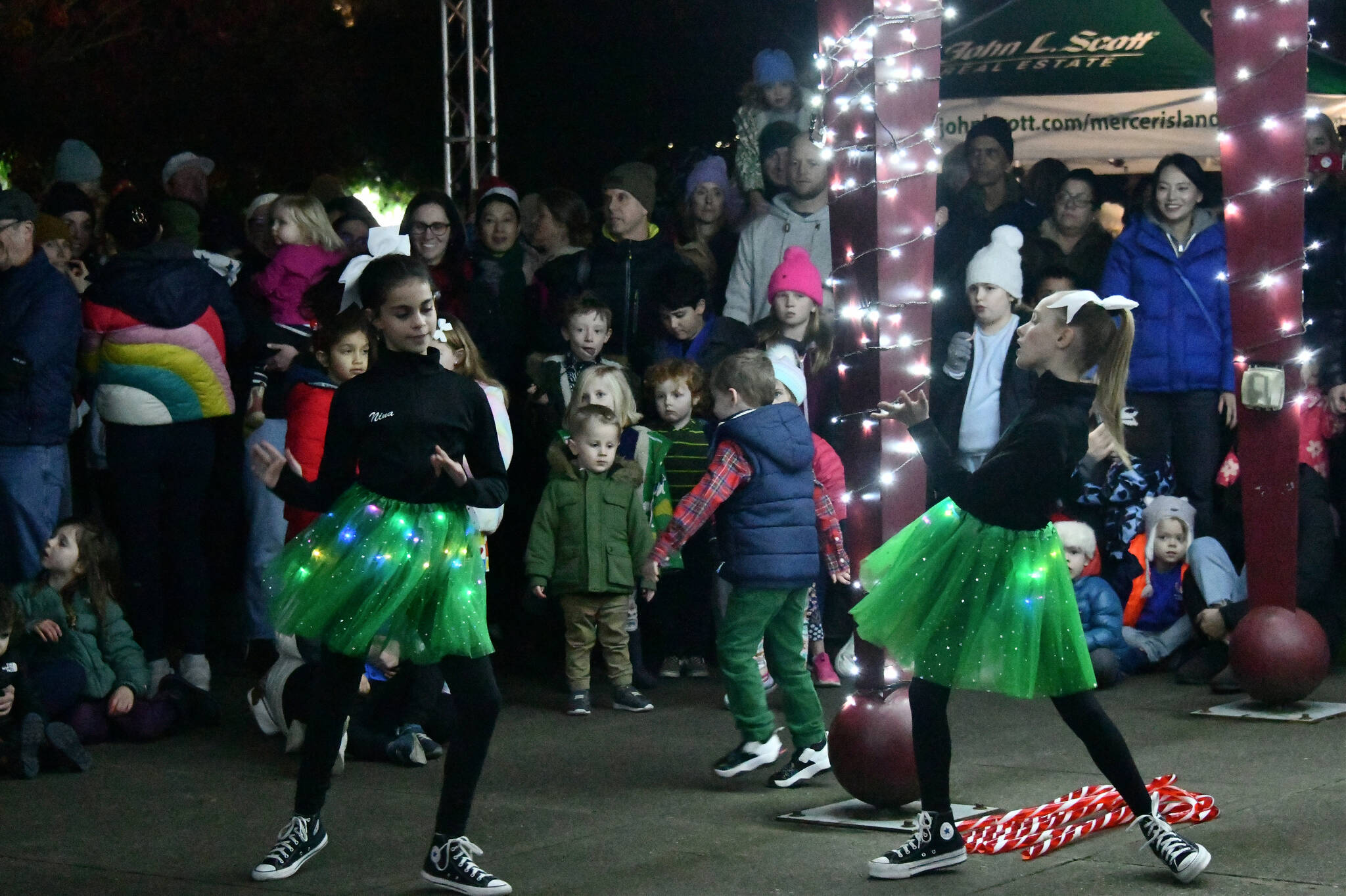 Members of Creation Dance Studio perform at the Illuminate MI tree lighting on Dec. 5 at Mercerdale Park. The city of Mercer Island event featured the Mercer Island High School choir along with a host of Creation Dance Studio performers and John L. Scott representatives handing out goodies. The event was sponsored by Mercer Island City Lifestyle and Puget Sound Energy. Andy Nystrom/ staff photo