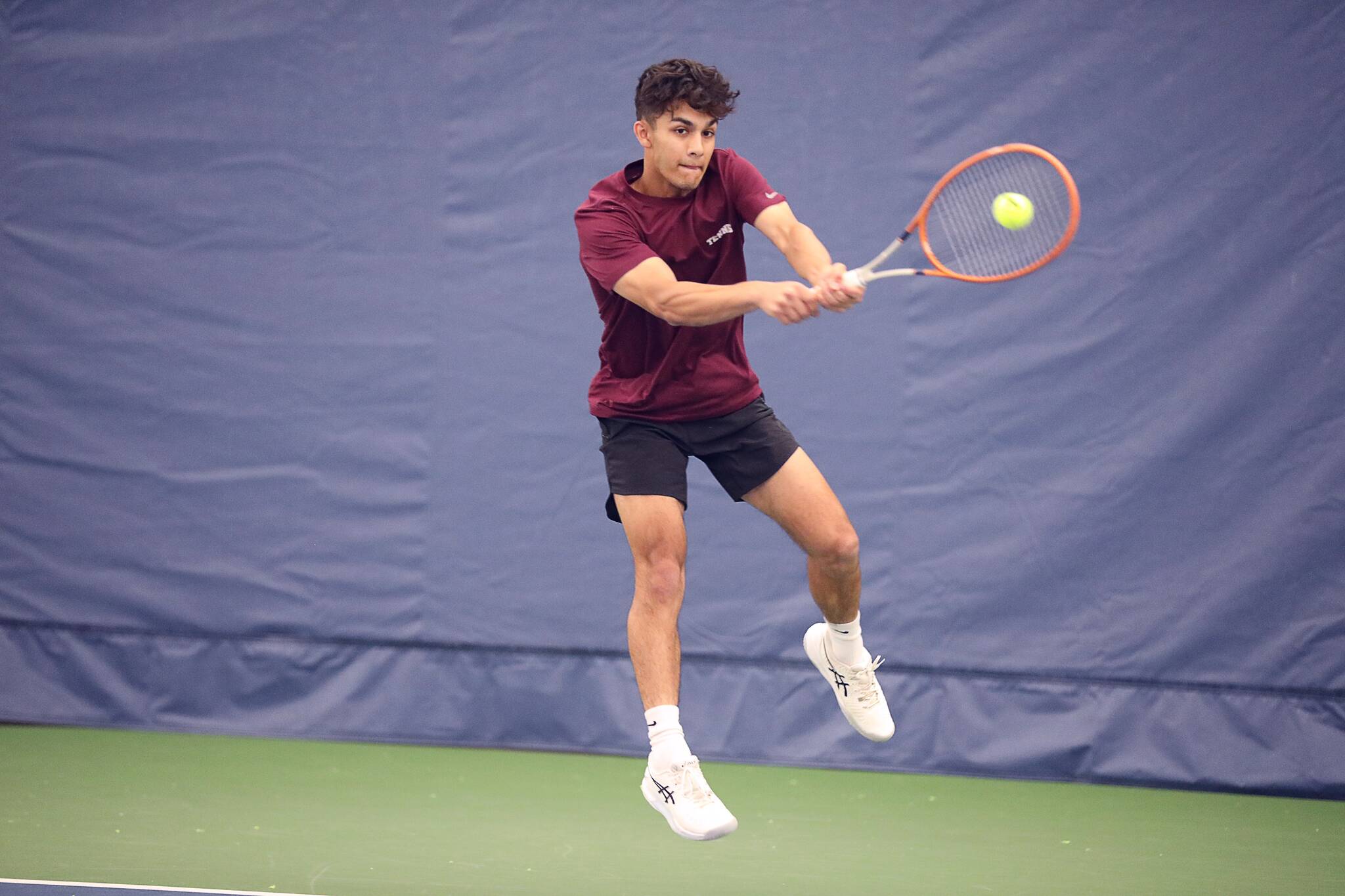 Mercer Island High School senior tennis player Gian Manhas. Photo courtesy of Northwest Sports Photography