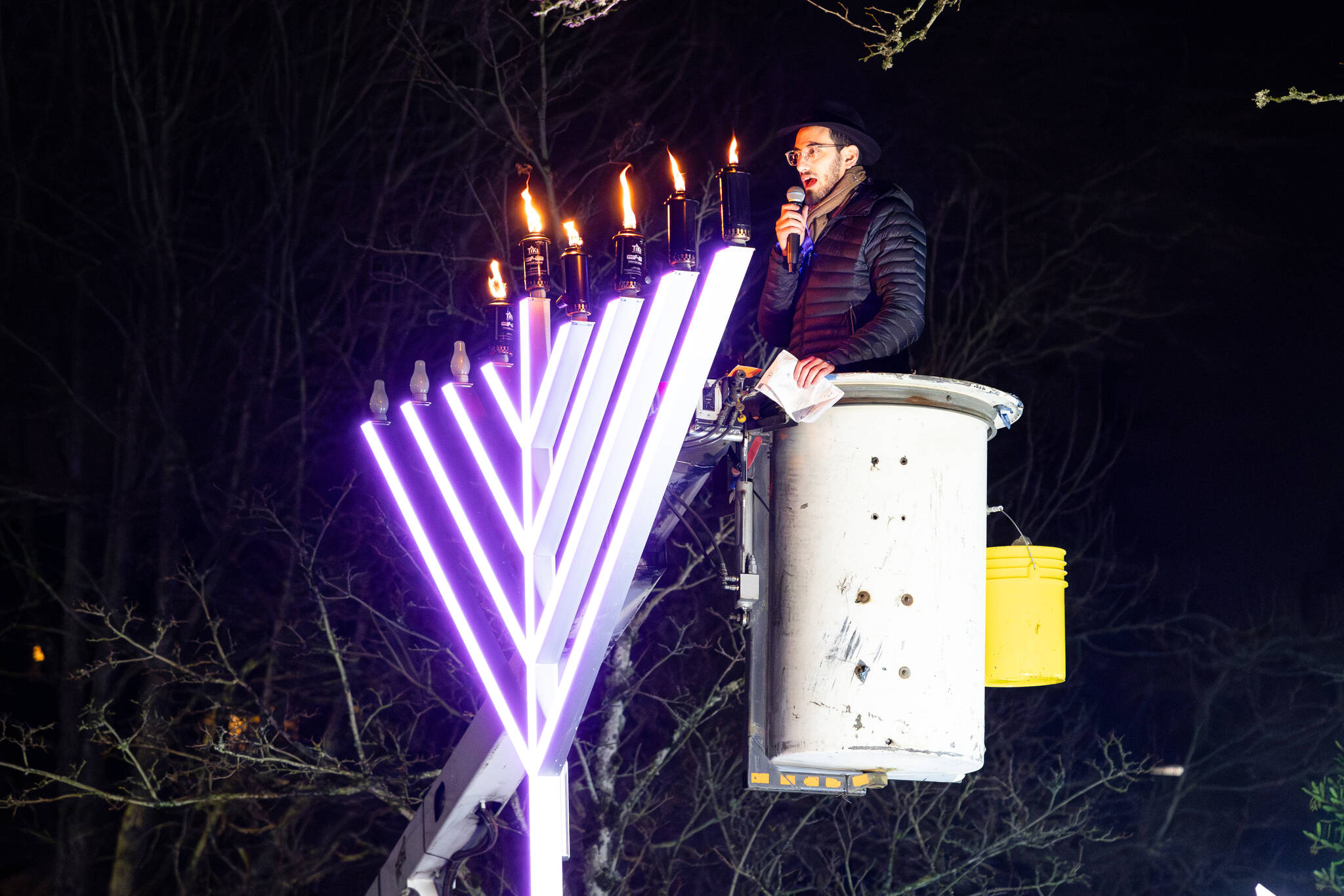 Rabbi Nissan Kornfeld of Chabad Mercer Island leads the menorah lighting at the 2024 Chanukah celebration on Dec. 29 at Mercerdale Park. Photo courtesy of Henry Rodenburg